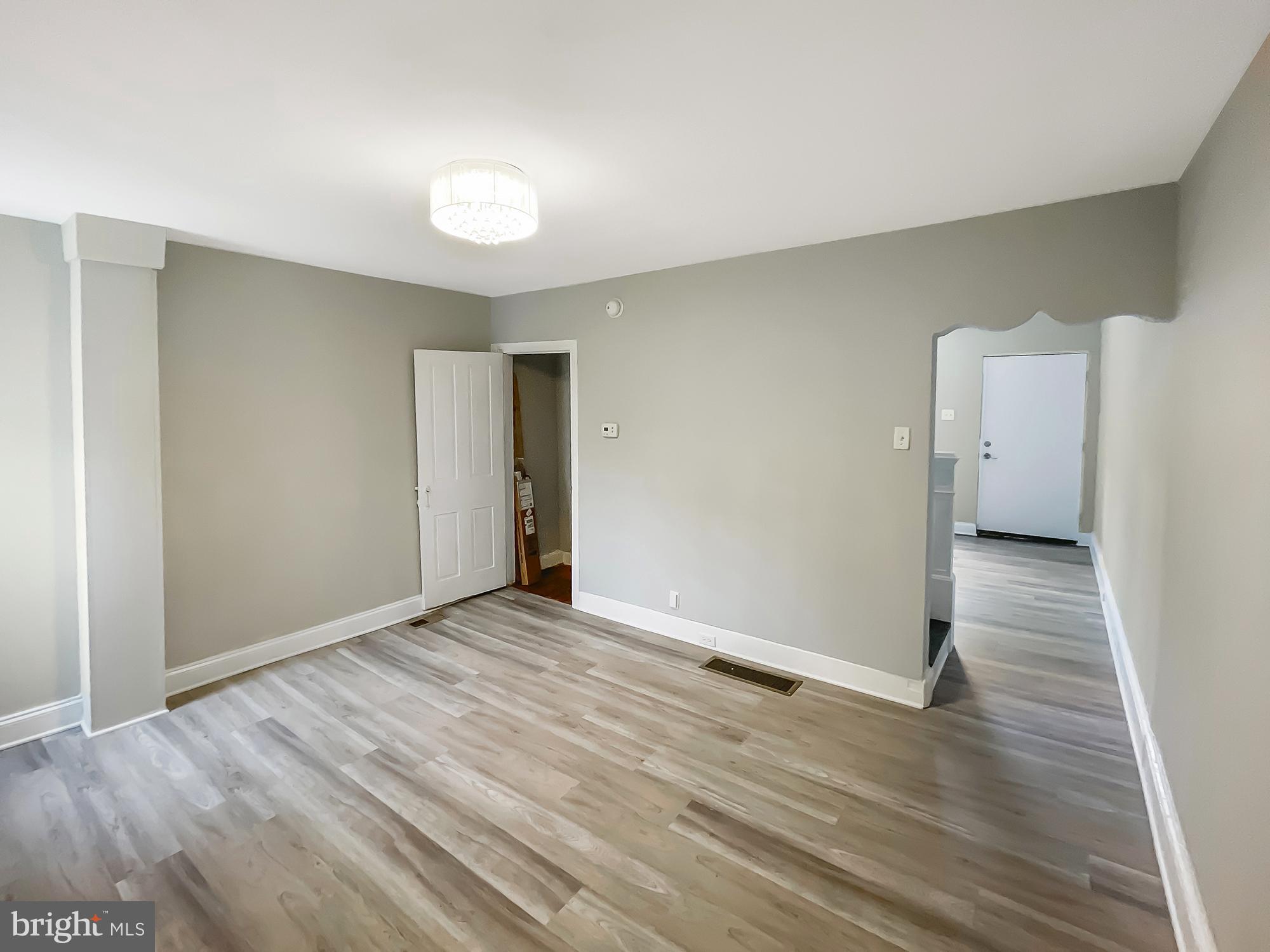 160 McClellan Street Philadelphia, PA 19148 - Photo 14 of 29 a view of an empty room with wooden floor and a sink