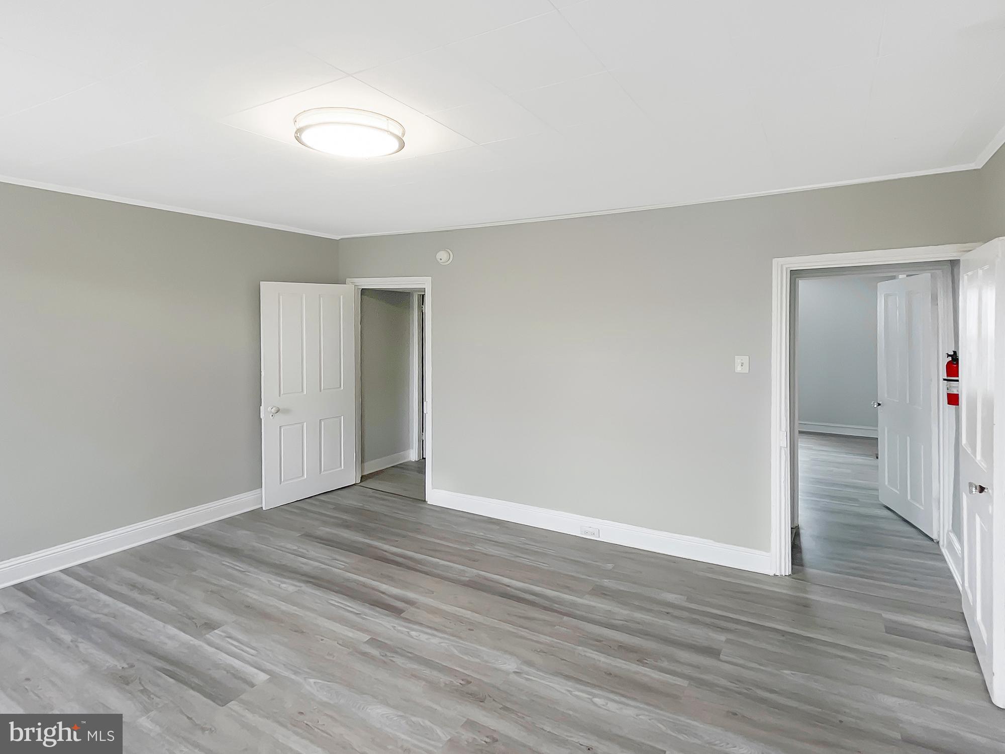 160 McClellan Street Philadelphia, PA 19148 - Photo 15 of 29 a view of an empty room with wooden floor