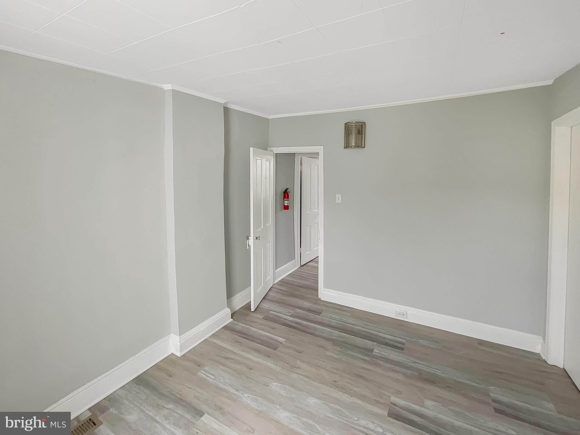 160 McClellan Street Philadelphia, PA 19148 - Photo 18 of 29 a view of an empty room with wooden floor
