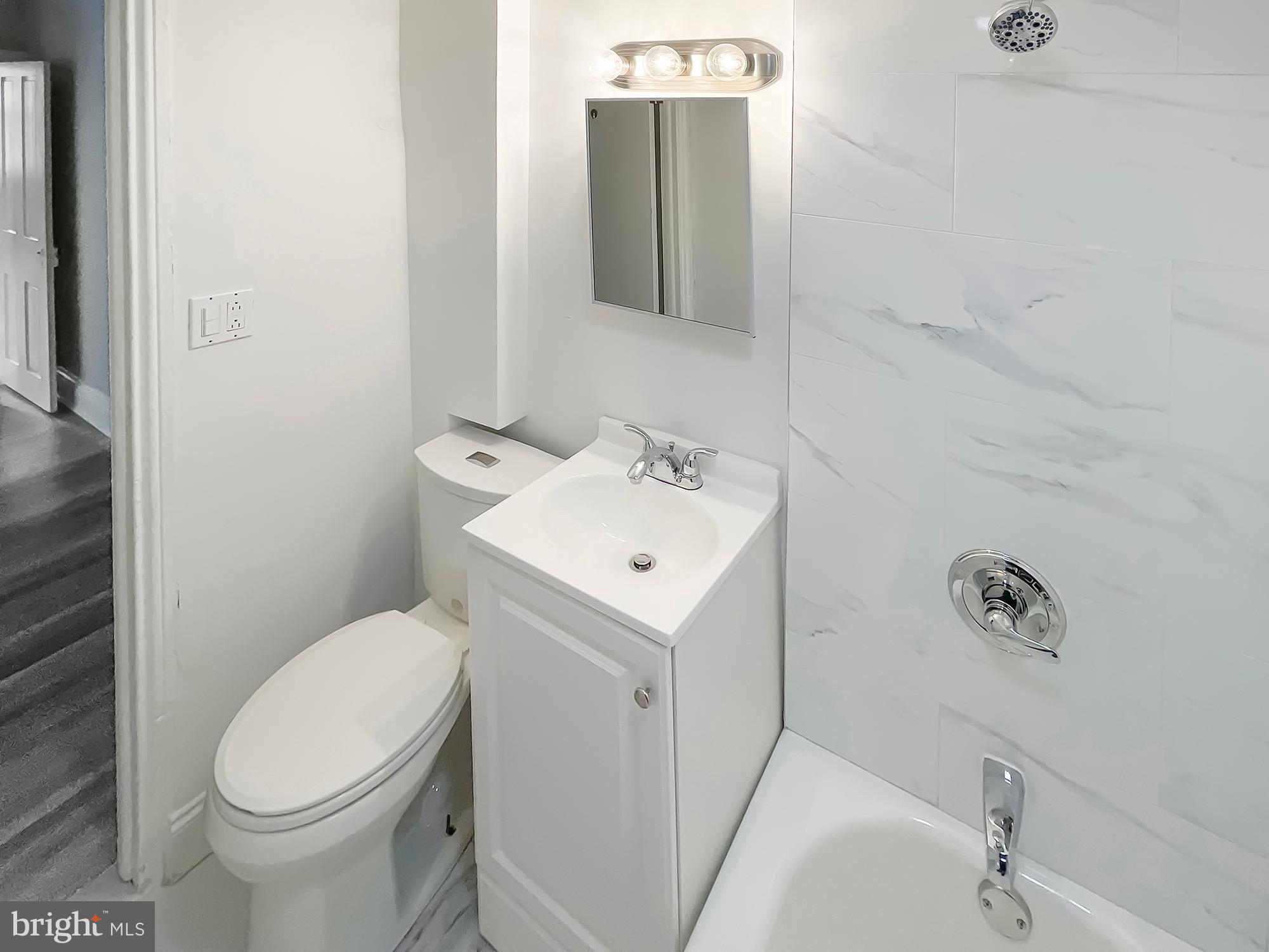 160 McClellan Street Philadelphia, PA 19148 - Photo 21 of 29 a white toilet sitting next to a white sink