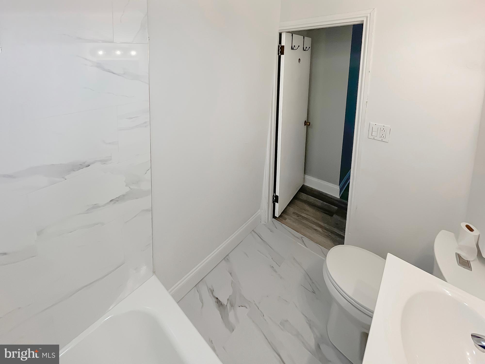 160 McClellan Street Philadelphia, PA 19148 - Photo 24 of 29 a bathroom with a sink a toilet and shower