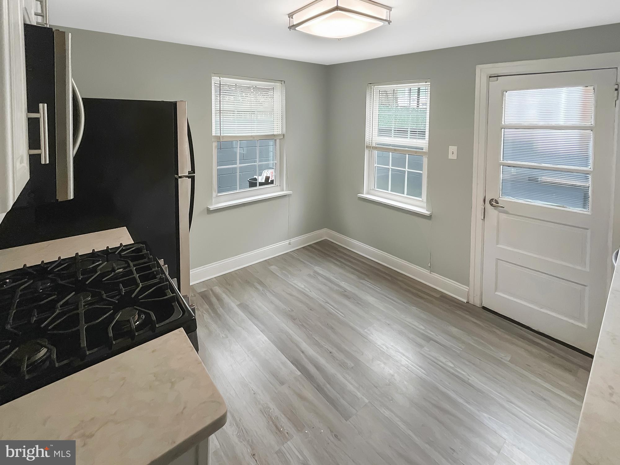 160 McClellan Street Philadelphia, PA 19148 - Photo 6 of 29 a living room with wooden floor and a window