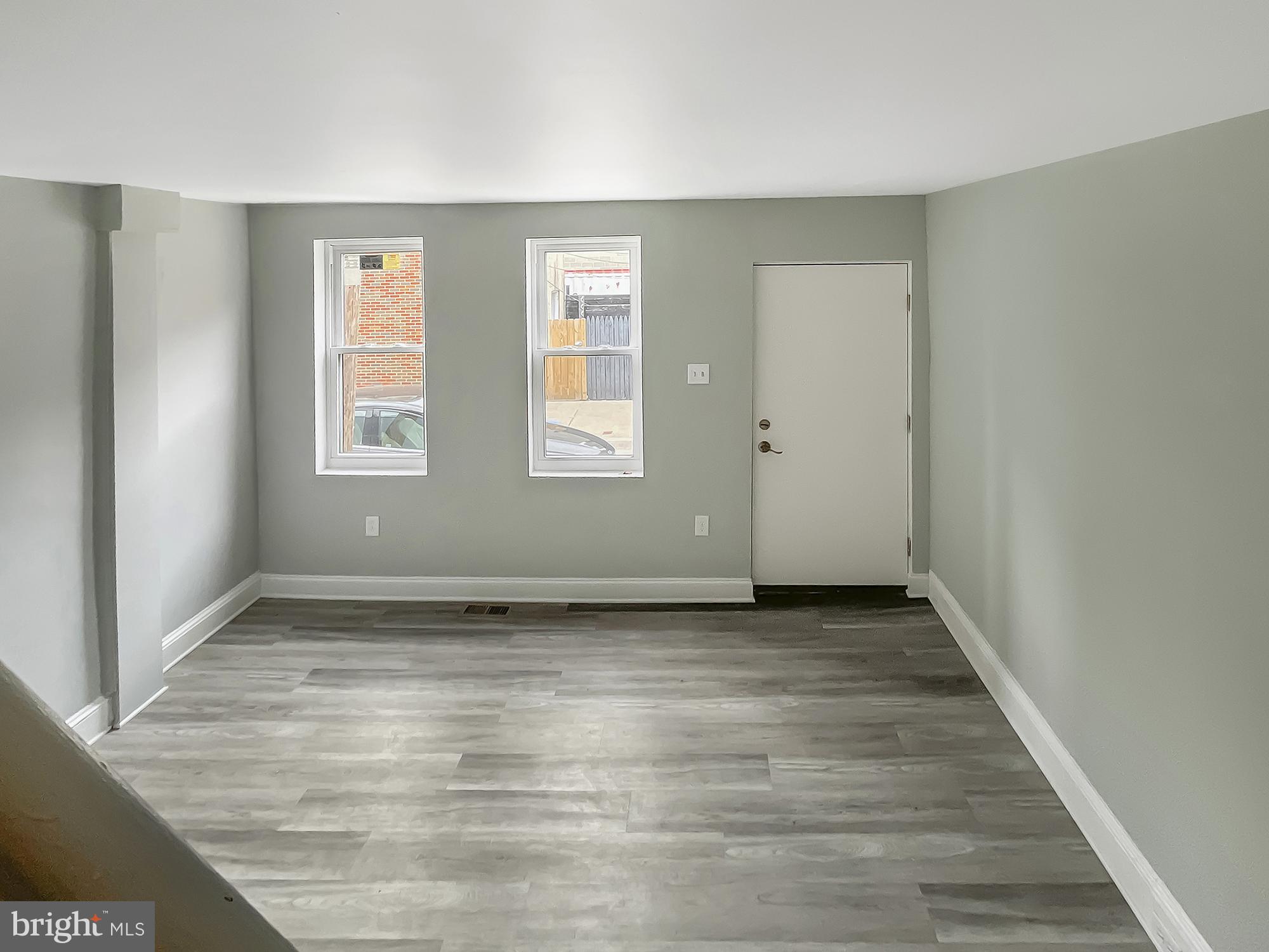 160 McClellan Street Philadelphia, PA 19148 - Photo 9 of 29 wooden floor in an empty room with a window