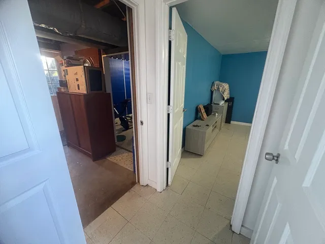 a spacious bedroom with a bed and window