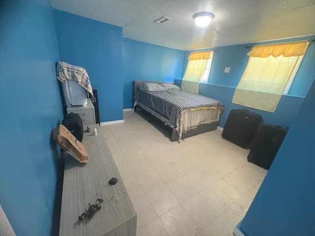 a view of a livingroom with furniture and a fireplace