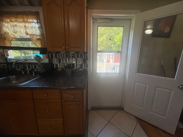 a bathroom with a sink and a window
