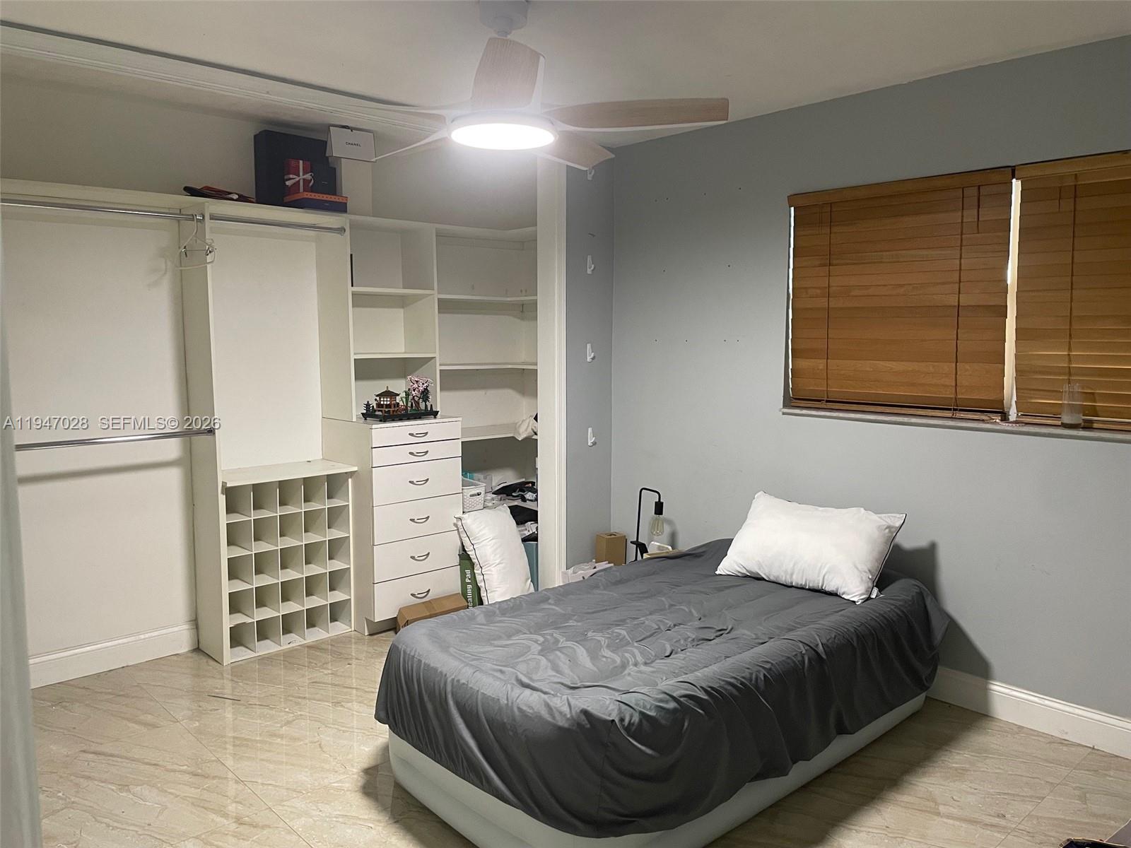 14503 Southwest 84th Street Miami, FL 33143 - Photo 20 of 23 a bedroom with a bed and closet