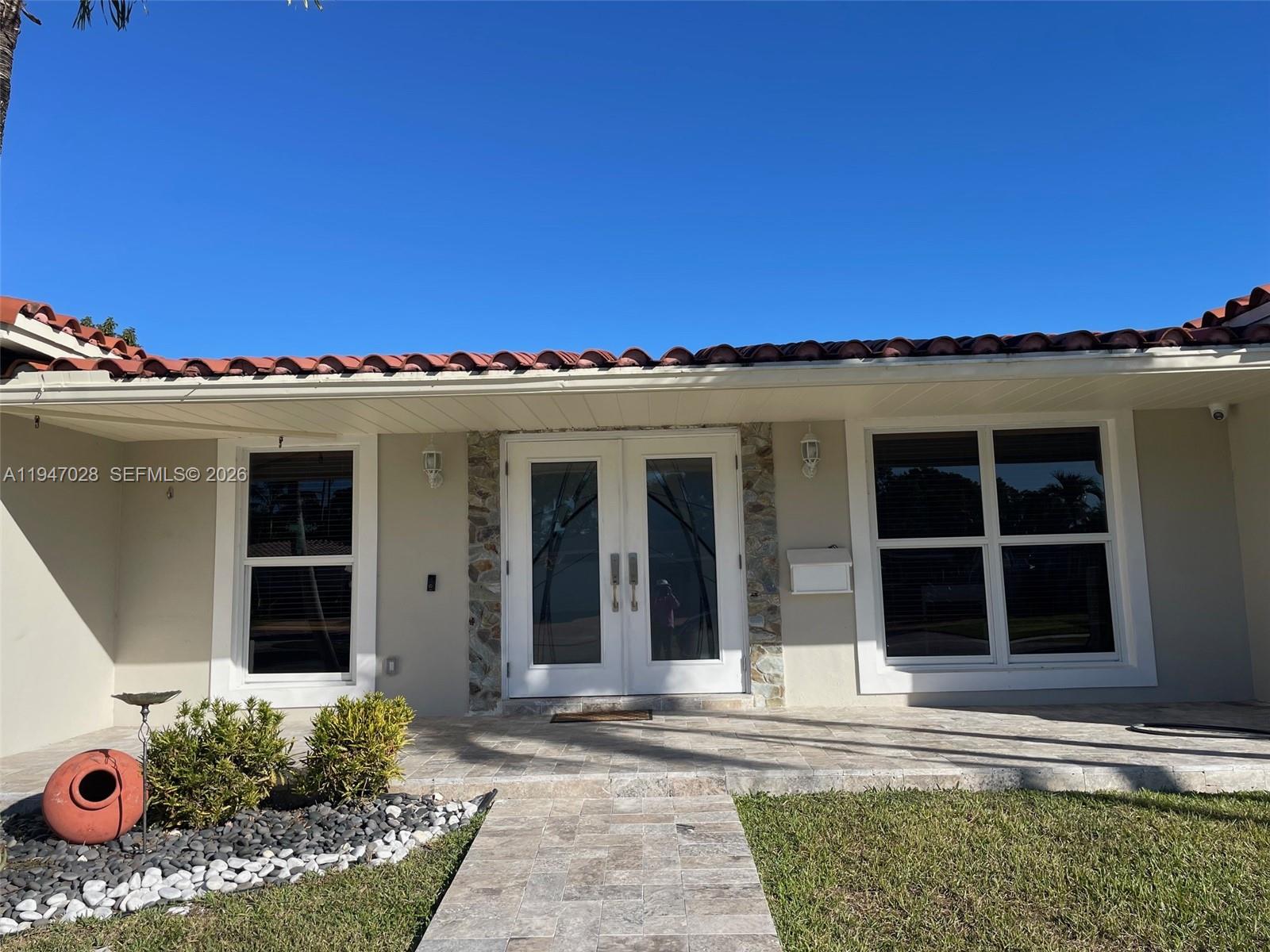 14503 Southwest 84th Street Miami, FL 33143 - Photo 2 of 23 front view of a house with a outdoor space