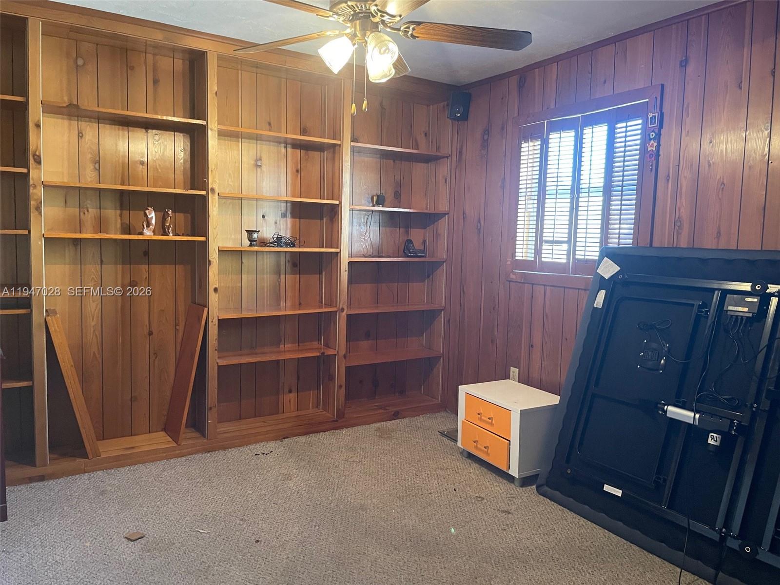 14503 Southwest 84th Street Miami, FL 33143 - Photo 21 of 23 a room with closet and windows