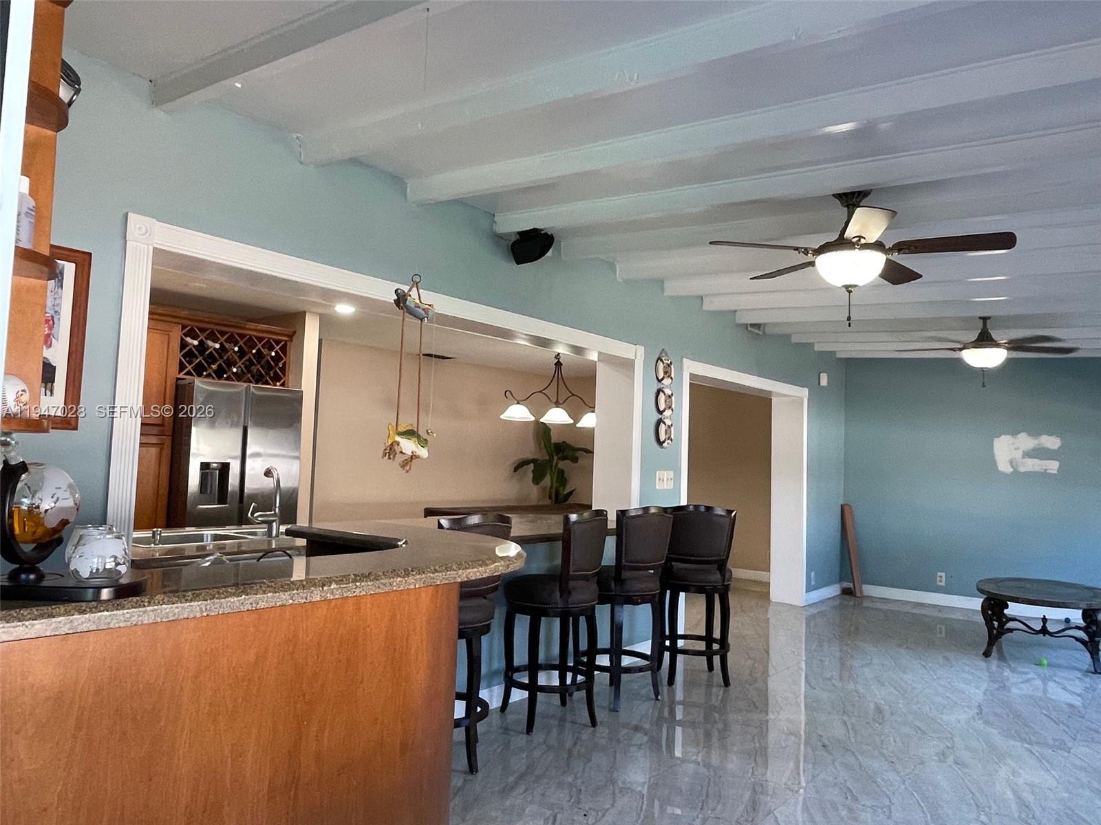 14503 Southwest 84th Street Miami, FL 33143 - Photo 23 of 23 a view of a dining room with furniture and wooden floor