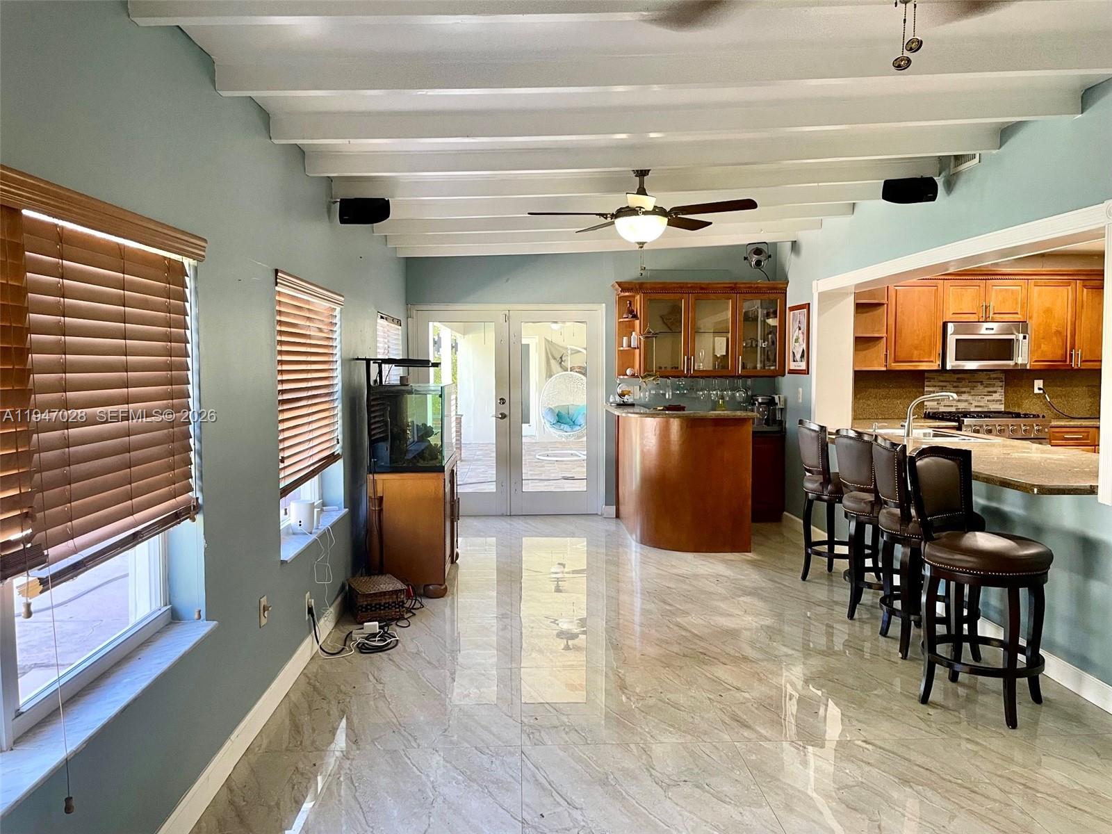 14503 Southwest 84th Street Miami, FL 33143 - Photo 9 of 23 a view of a dining room with furniture window and wooden floor