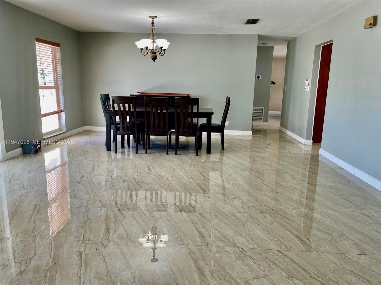 14503 Southwest 84th Street Miami, FL 33143 - Photo 10 of 23 a view of a dining room with furniture