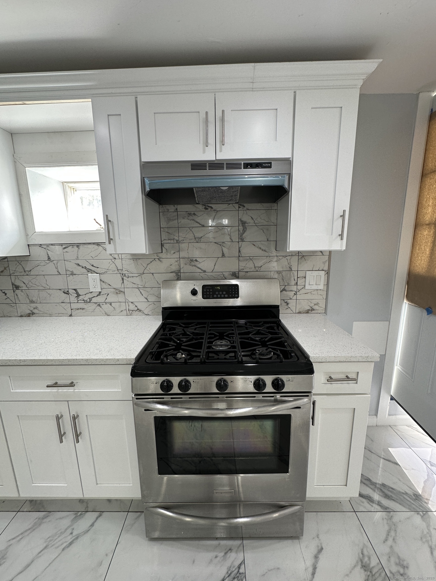 48 Prest Street New London, CT 06320 - Photo 11 of 27 a stove top oven sitting inside of a kitchen