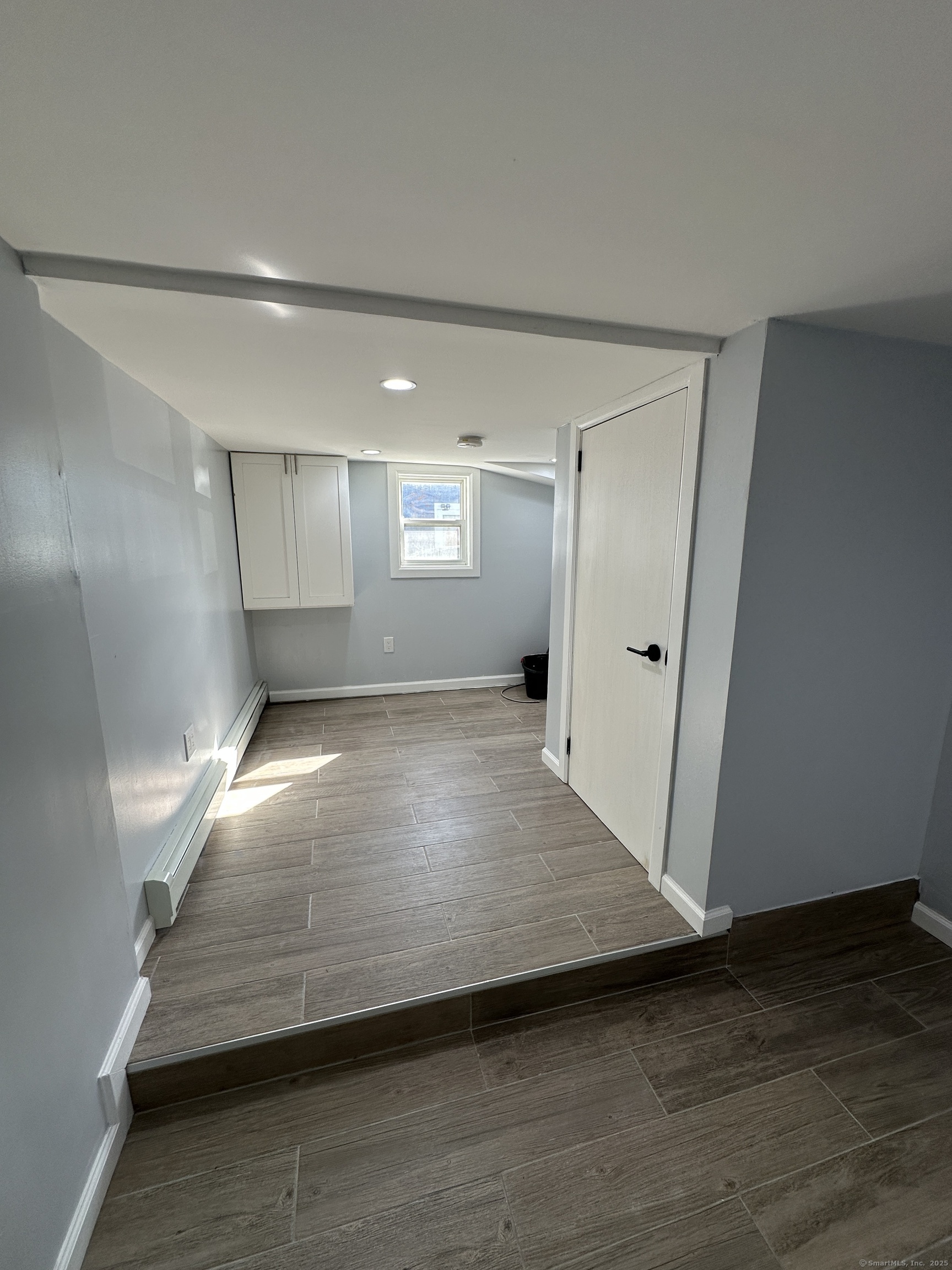 48 Prest Street New London, CT 06320 - Photo 16 of 27 a view of empty room with wooden floor