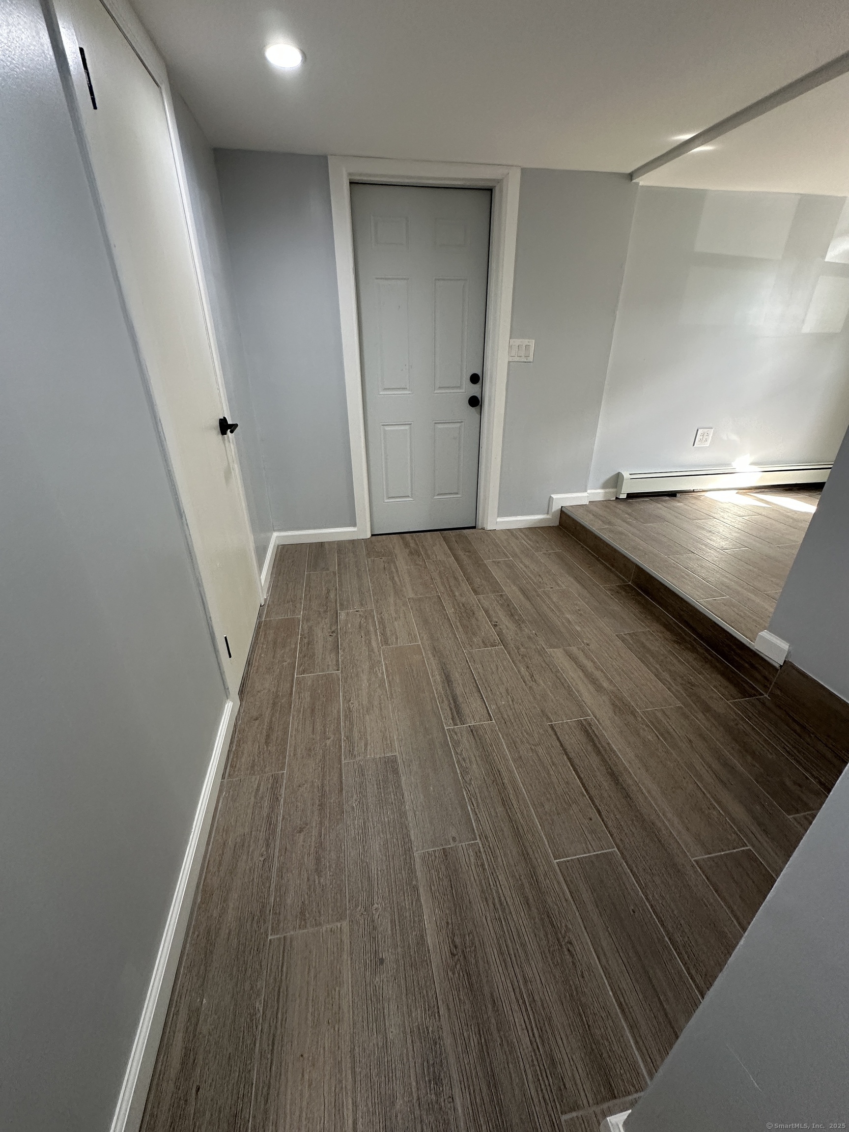 48 Prest Street New London, CT 06320 - Photo 20 of 27 a view of a hallway with wooden floor
