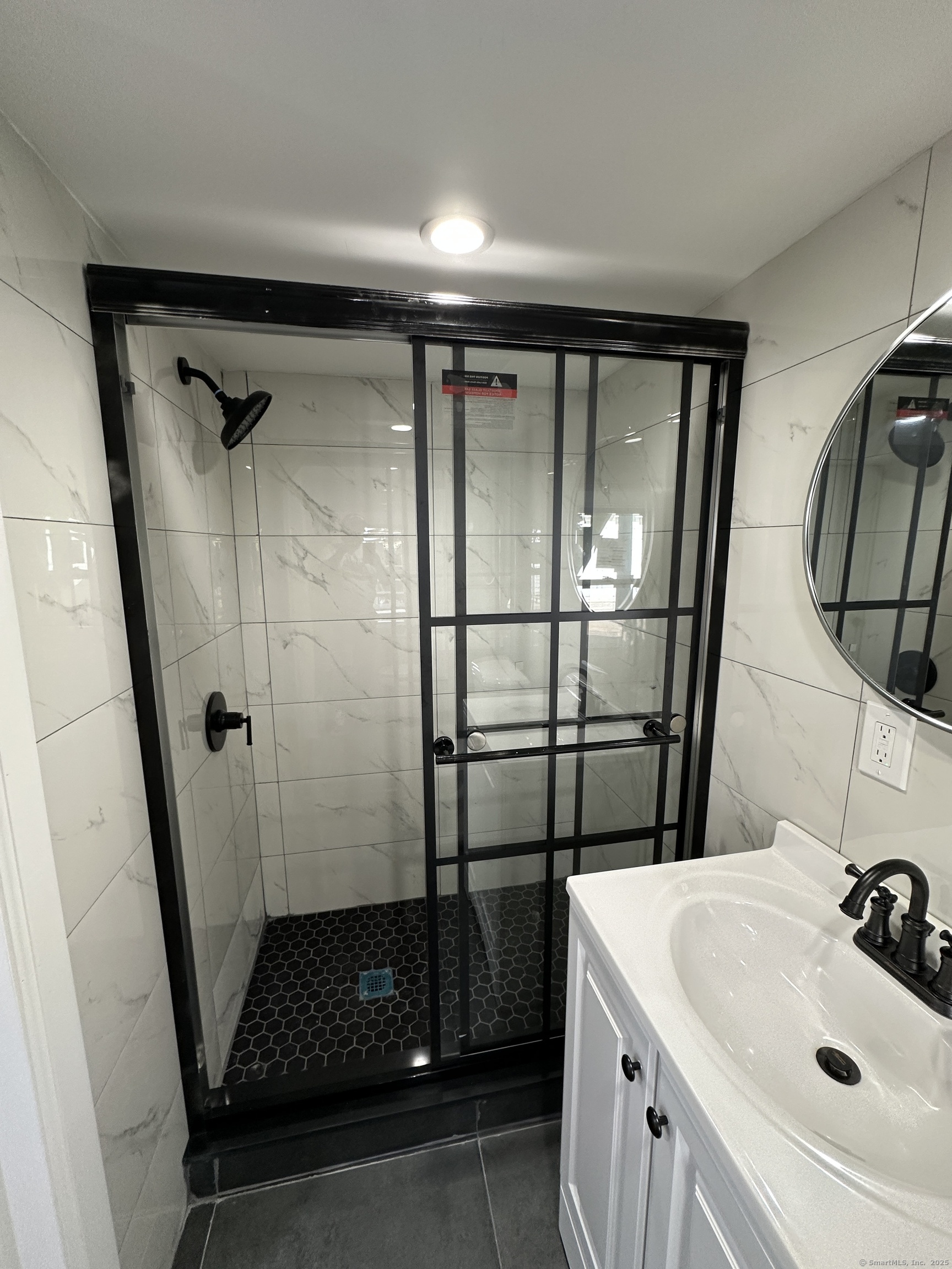 48 Prest Street New London, CT 06320 - Photo 24 of 27 a bathroom with a sink and a mirror