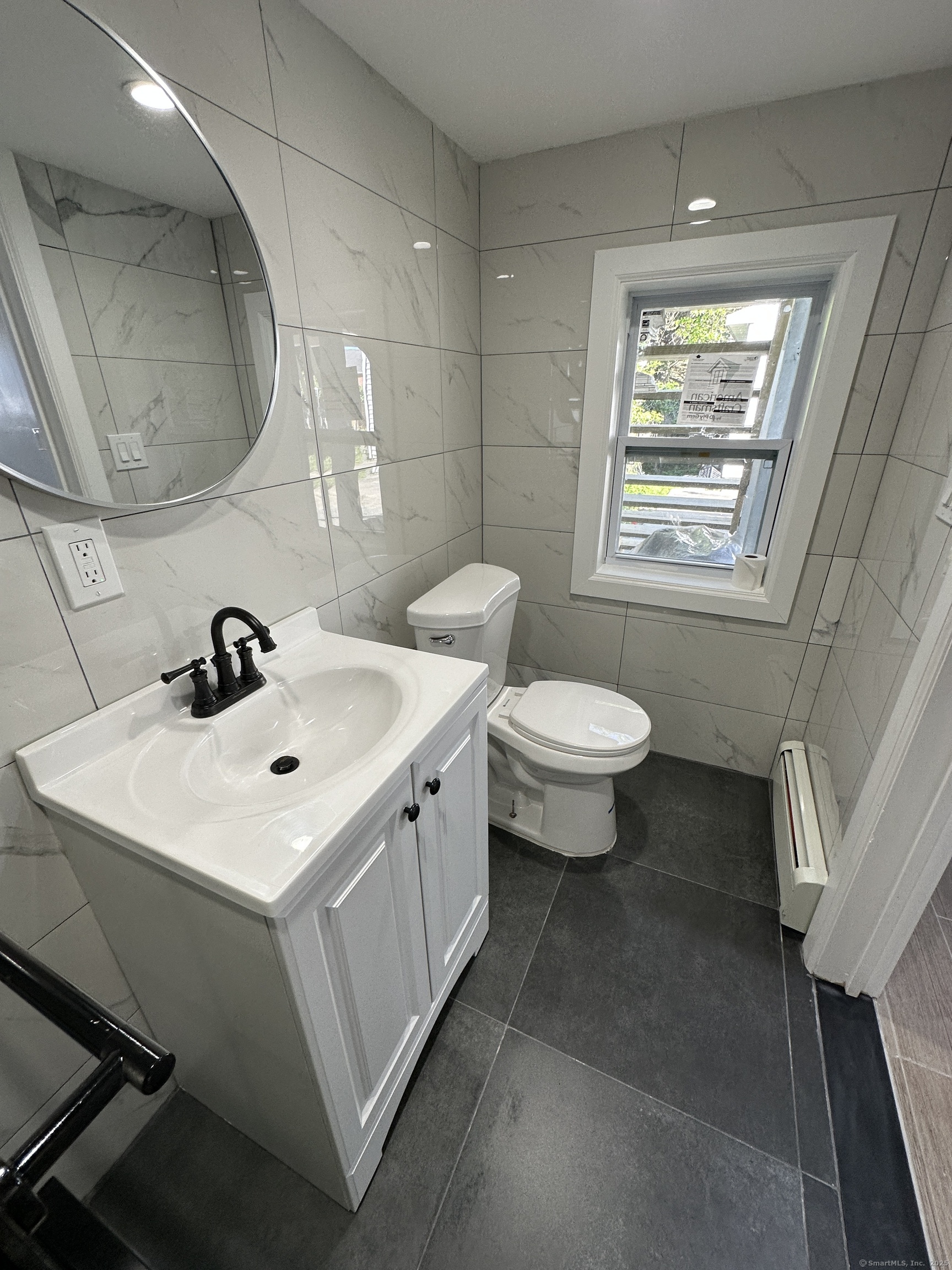 48 Prest Street New London, CT 06320 - Photo 25 of 27 a bathroom with a sink toilet and a mirror