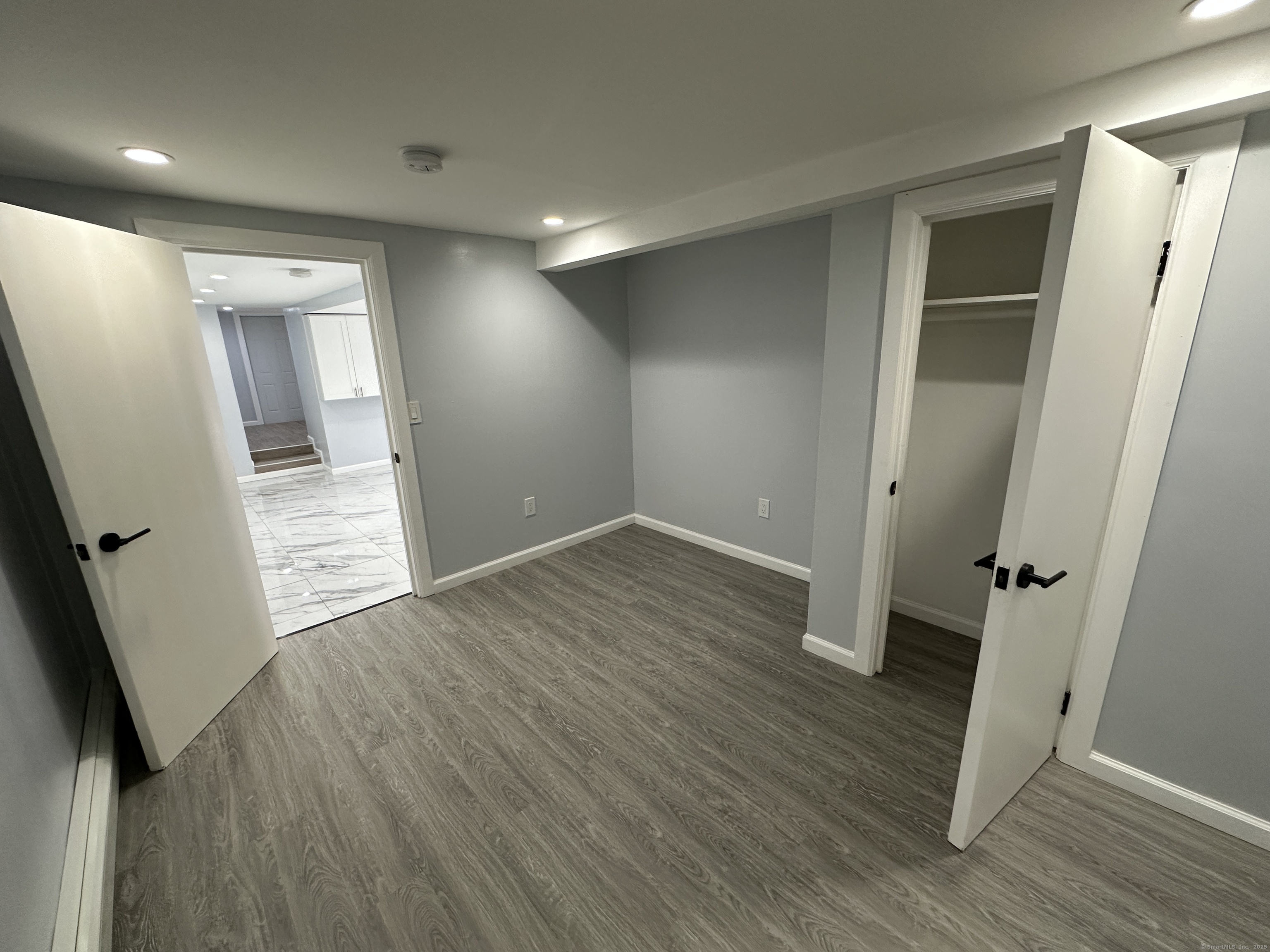 48 Prest Street New London, CT 06320 - Photo 8 of 27 wooden floor in an empty room with a window