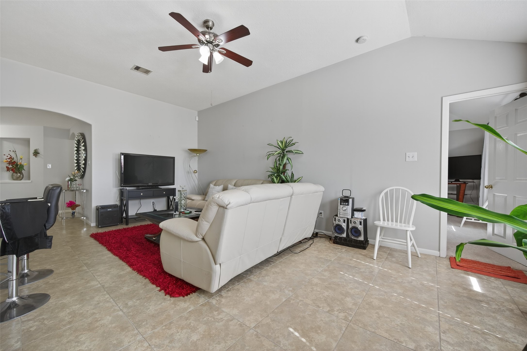 19655 Perth Meadows Court Katy, TX 77449 - Photo 15 of 44 a living room with furniture and a flat screen tv
