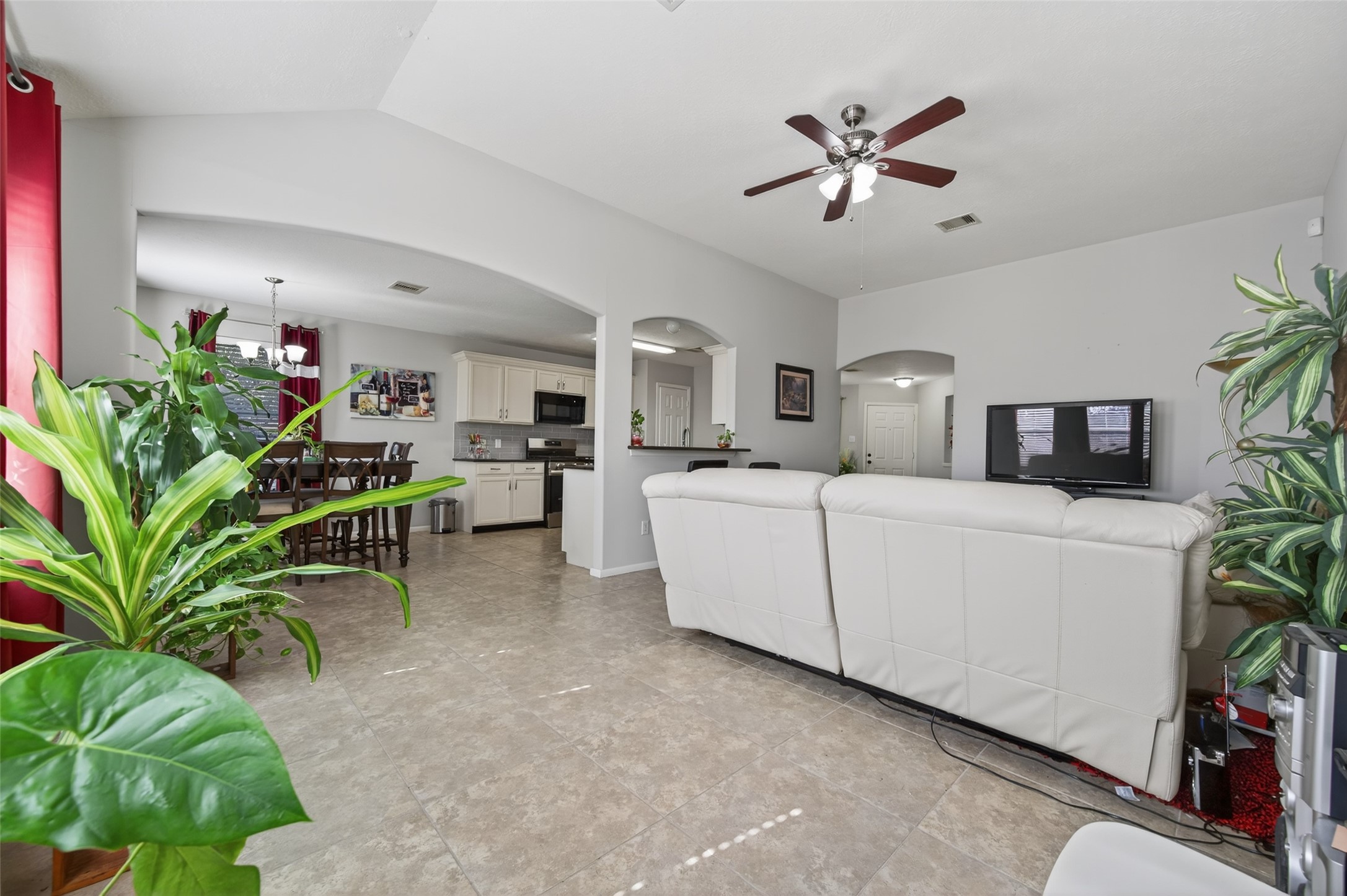 19655 Perth Meadows Court Katy, TX 77449 - Photo 17 of 44 a living room with furniture kitchen view and a potted plant