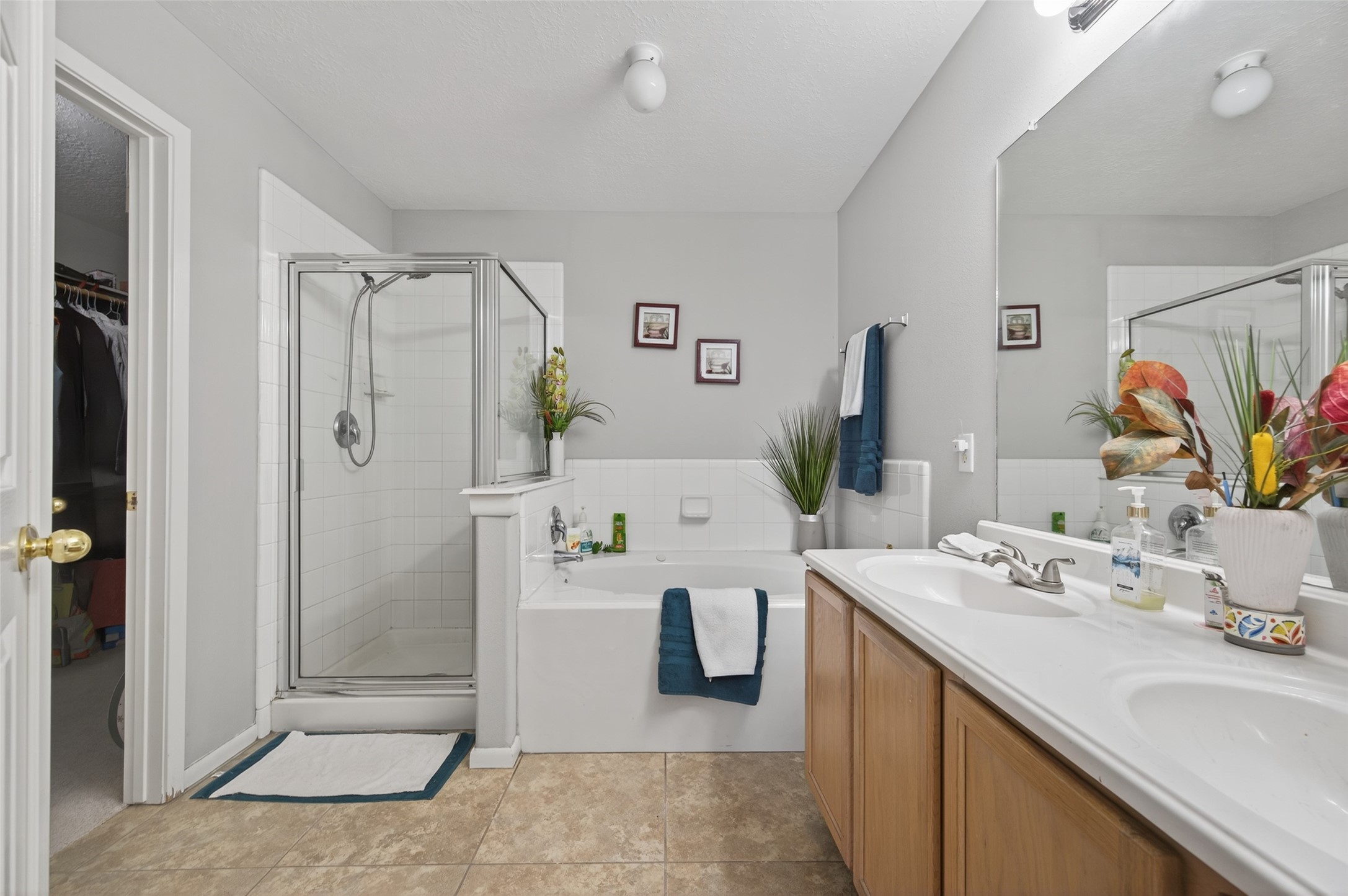 19655 Perth Meadows Court Katy, TX 77449 - Photo 35 of 44 a bathroom with a tub sink mirror and shower