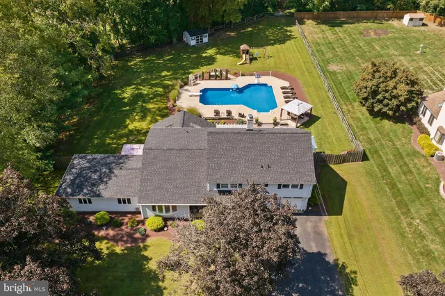 an aerial view of a house with a lake view