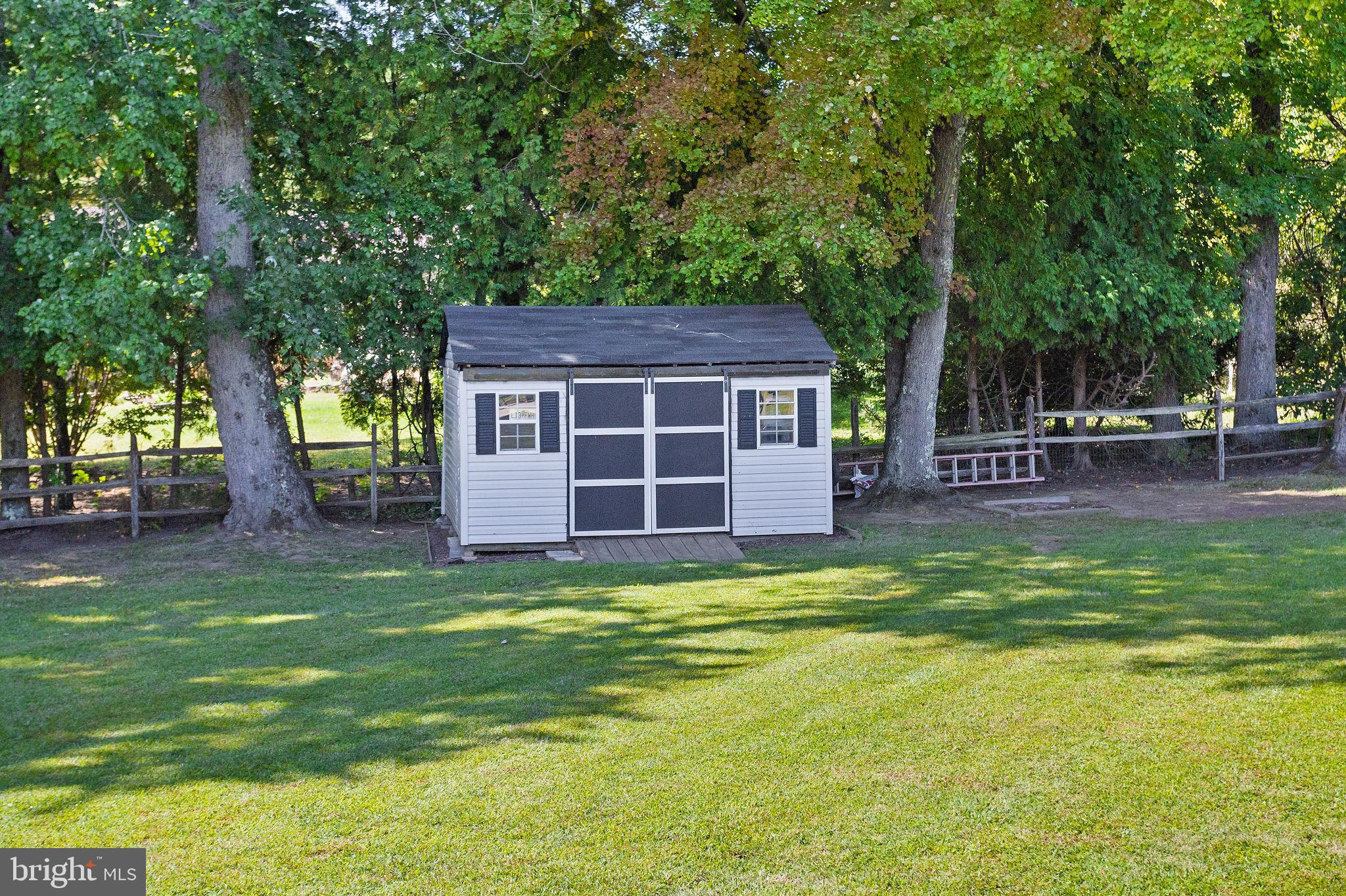 420 Extonville Road Allentown, NJ 08501 - Photo 20 of 57 a view of a house with a backyard and a tree