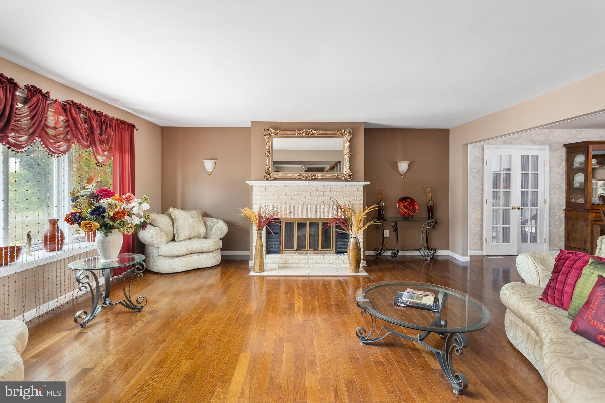 420 Extonville Road Allentown, NJ 08501 - Photo 26 of 57 a living room with furniture and a wooden floor