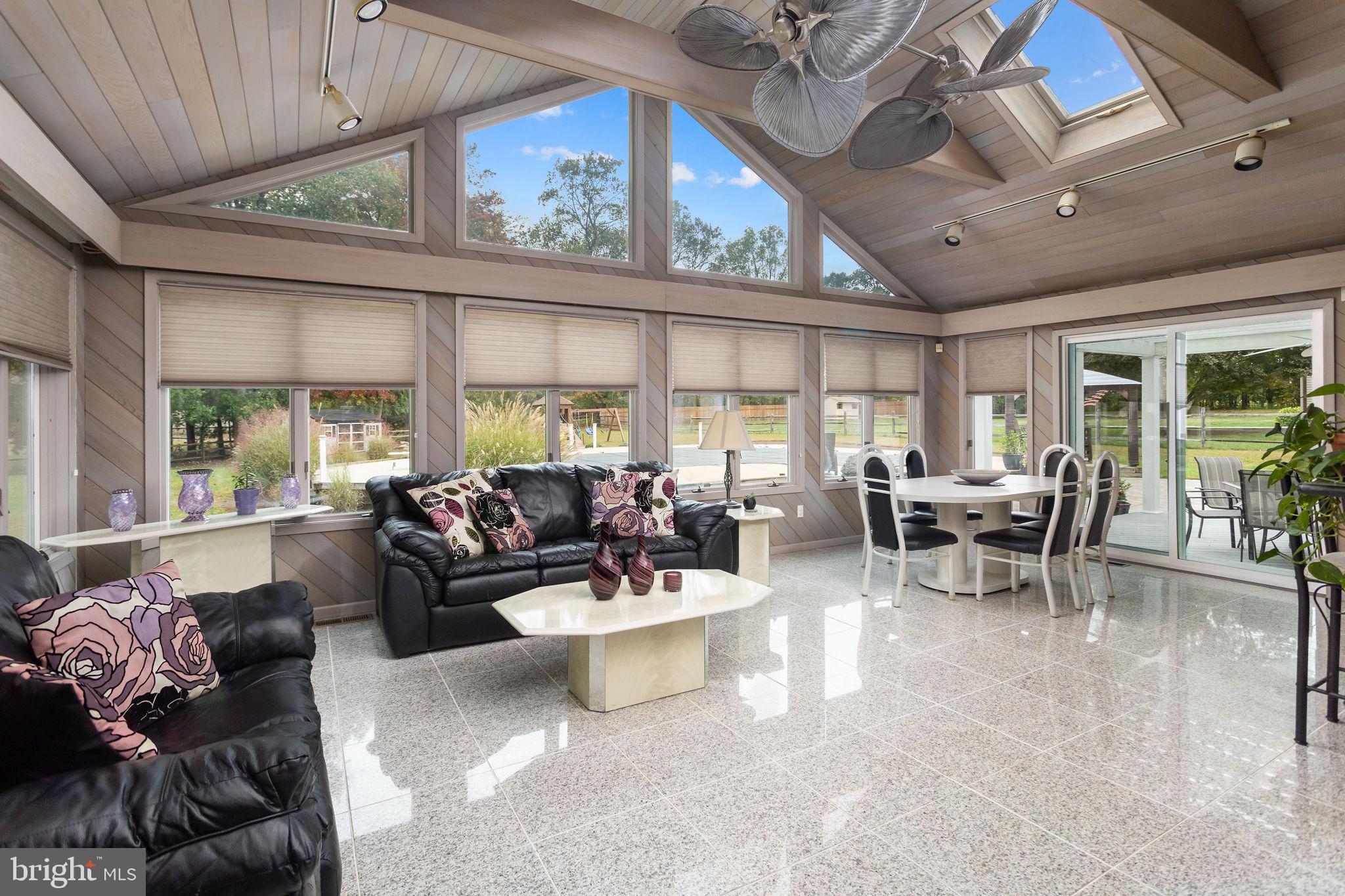 420 Extonville Road Allentown, NJ 08501 - Photo 30 of 57 a living room with furniture and a large window