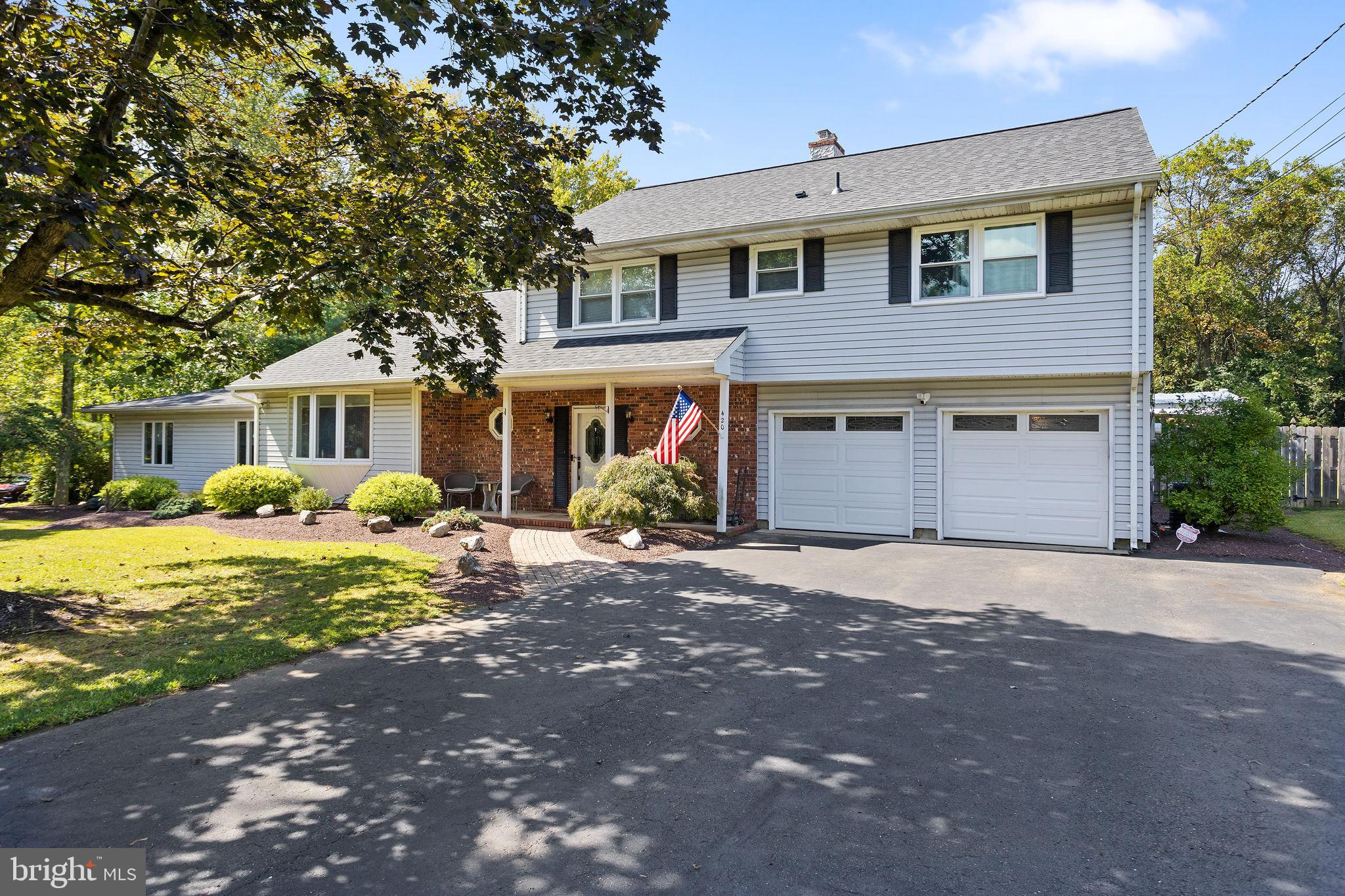 420 Extonville Road Allentown, NJ 08501 - Photo 3 of 57 a front view of a house with a yard and porch