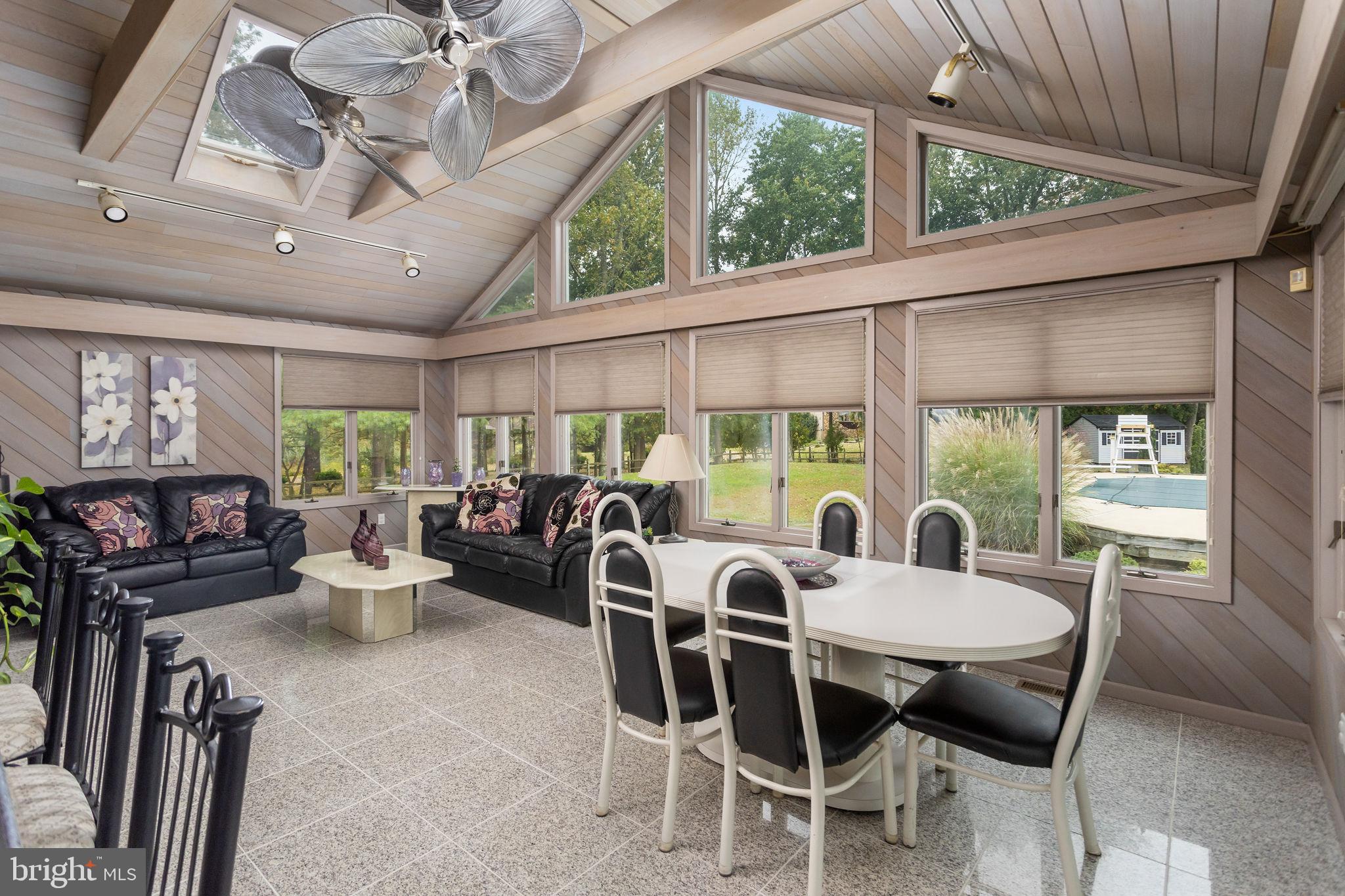 420 Extonville Road Allentown, NJ 08501 - Photo 31 of 57 a view of a dining room with furniture large windows and garden view