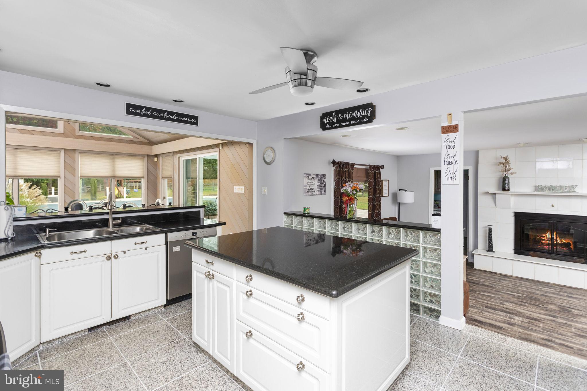420 Extonville Road Allentown, NJ 08501 - Photo 35 of 57 a kitchen with granite countertop a sink and center island