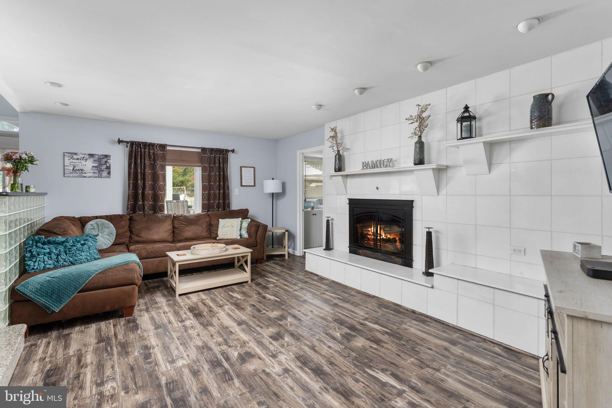 420 Extonville Road Allentown, NJ 08501 - Photo 36 of 57 a living room with furniture and a fireplace
