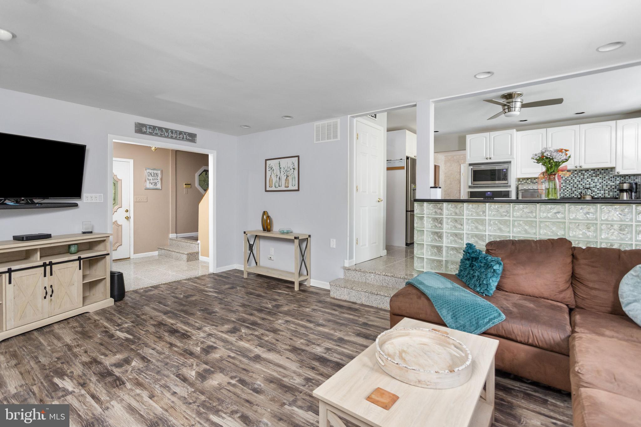 420 Extonville Road Allentown, NJ 08501 - Photo 37 of 57 a living room with furniture and a flat screen tv
