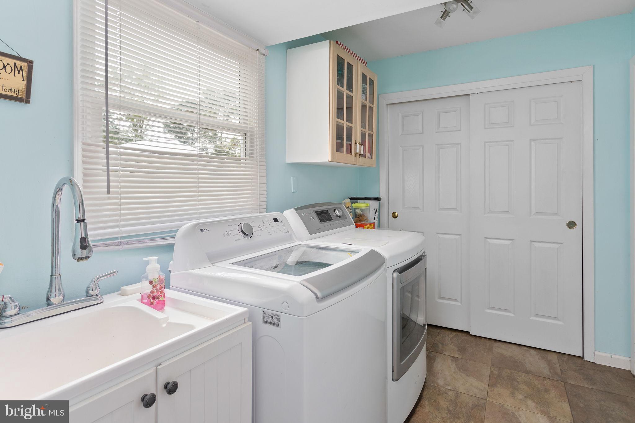 420 Extonville Road Allentown, NJ 08501 - Photo 39 of 57 a utility room with a sink dryer and washer
