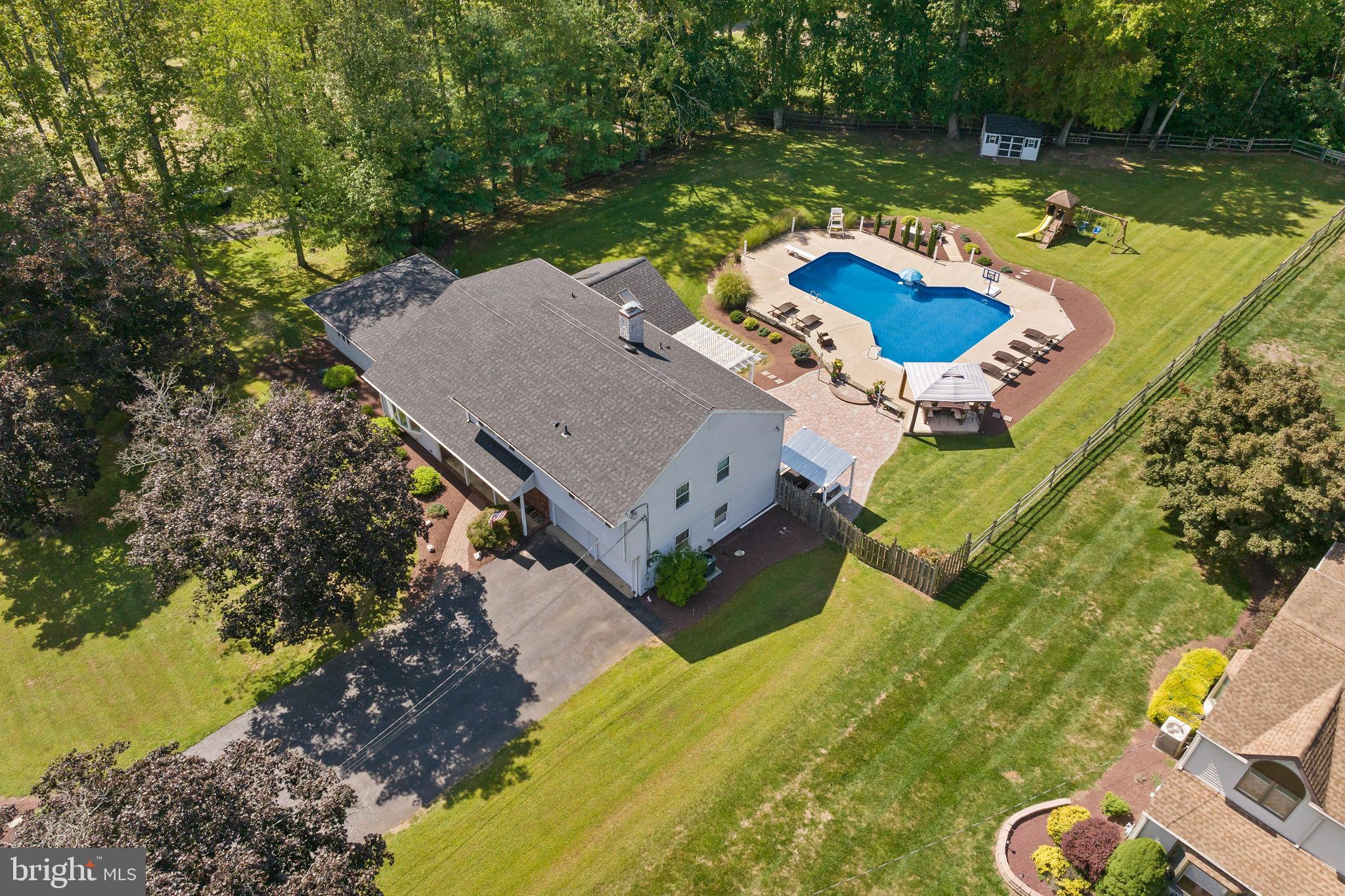 420 Extonville Road Allentown, NJ 08501 - Photo 4 of 57 an aerial view of a house with swimming pool and a yard