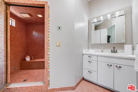 a bathroom with a sink and a mirror
