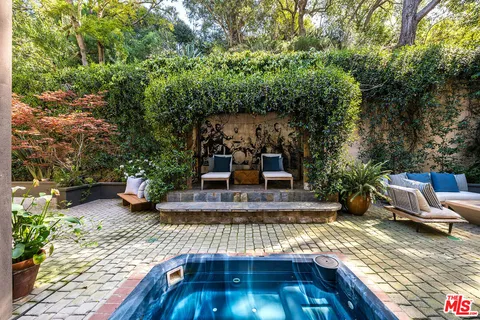 swimming pool view with a seating space