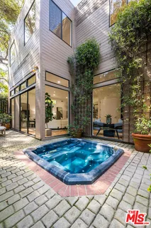 a view of a swimming pool with sitting area