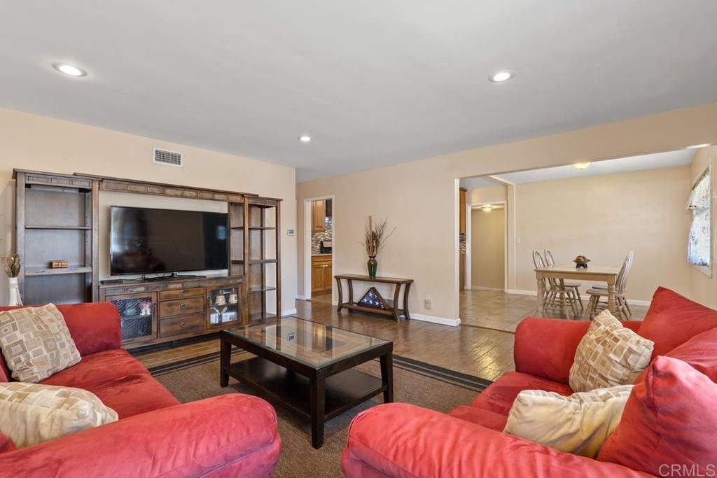 7825 Deborah Place Lemon Grove, CA 91945 - Photo 1 of 1 a living room with furniture and a flat screen tv