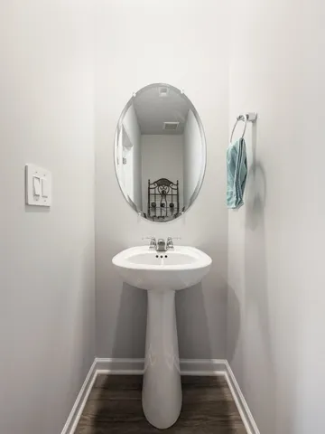 a bathroom with a sink and mirror