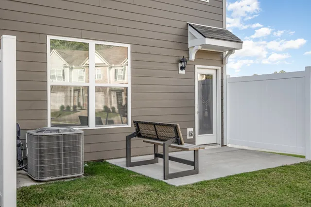 a view of a bench in the backyard
