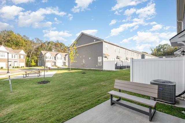 a view of a backyard with sitting area