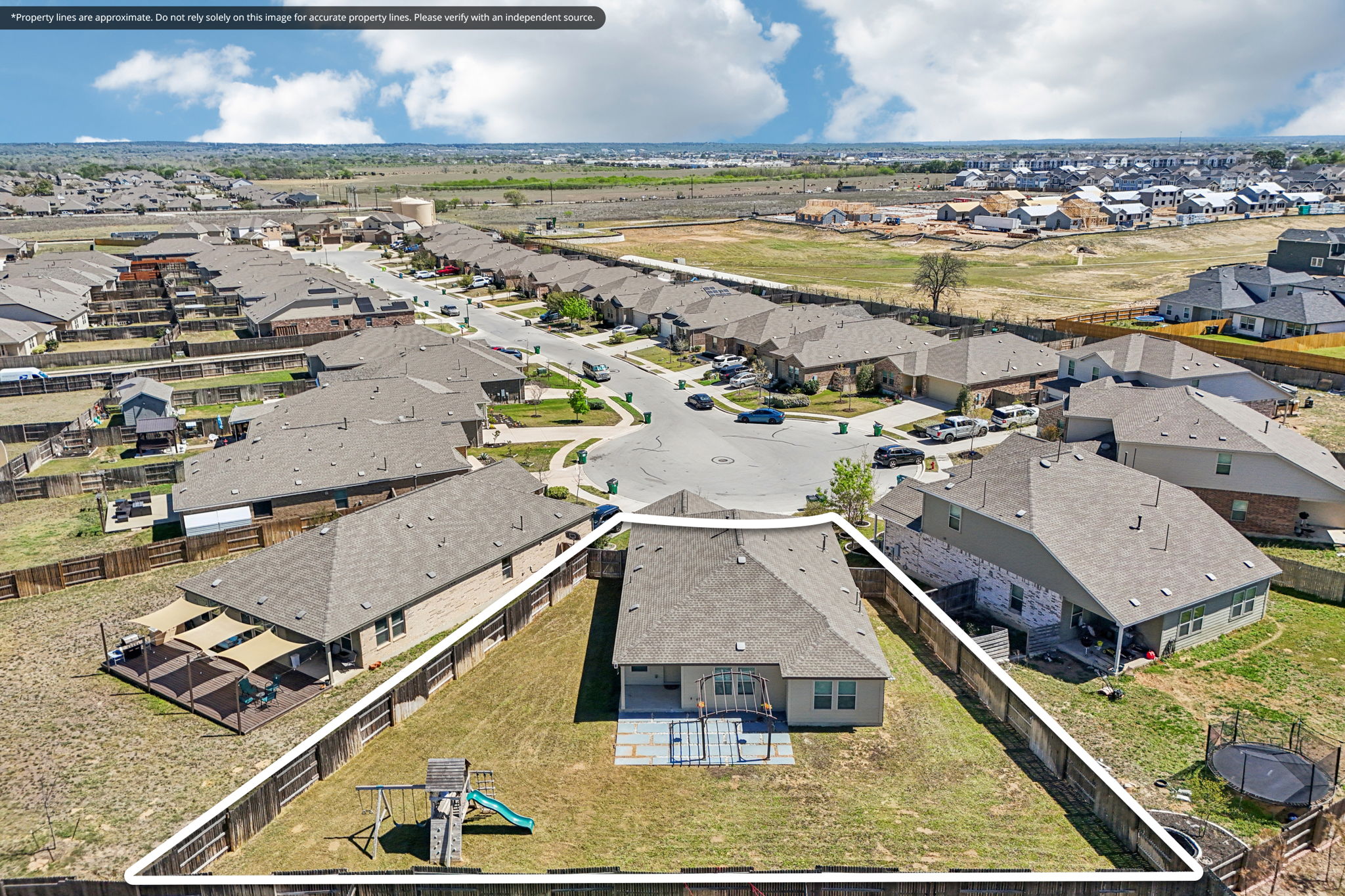 138 George Kimble Cove Bastrop, TX 78602 - Photo 2 of 40 Big backyard! Fenced too! And playset conveys, if desired.