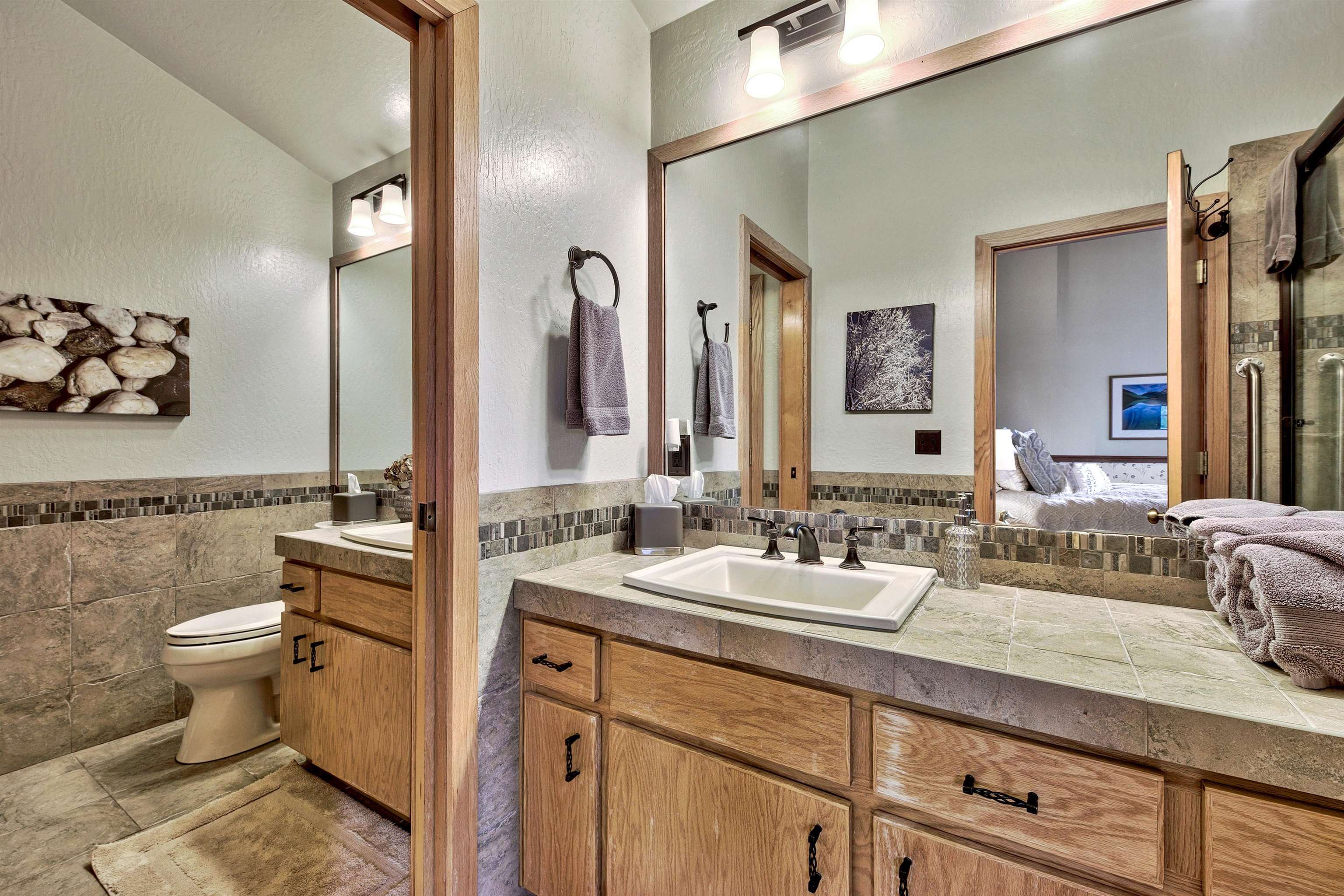 253 Basque Drive, Unit SHARE #7 Truckee, CA 96161 - Photo 10 of 21 a bathroom with a double vanity sink toilet and mirror
