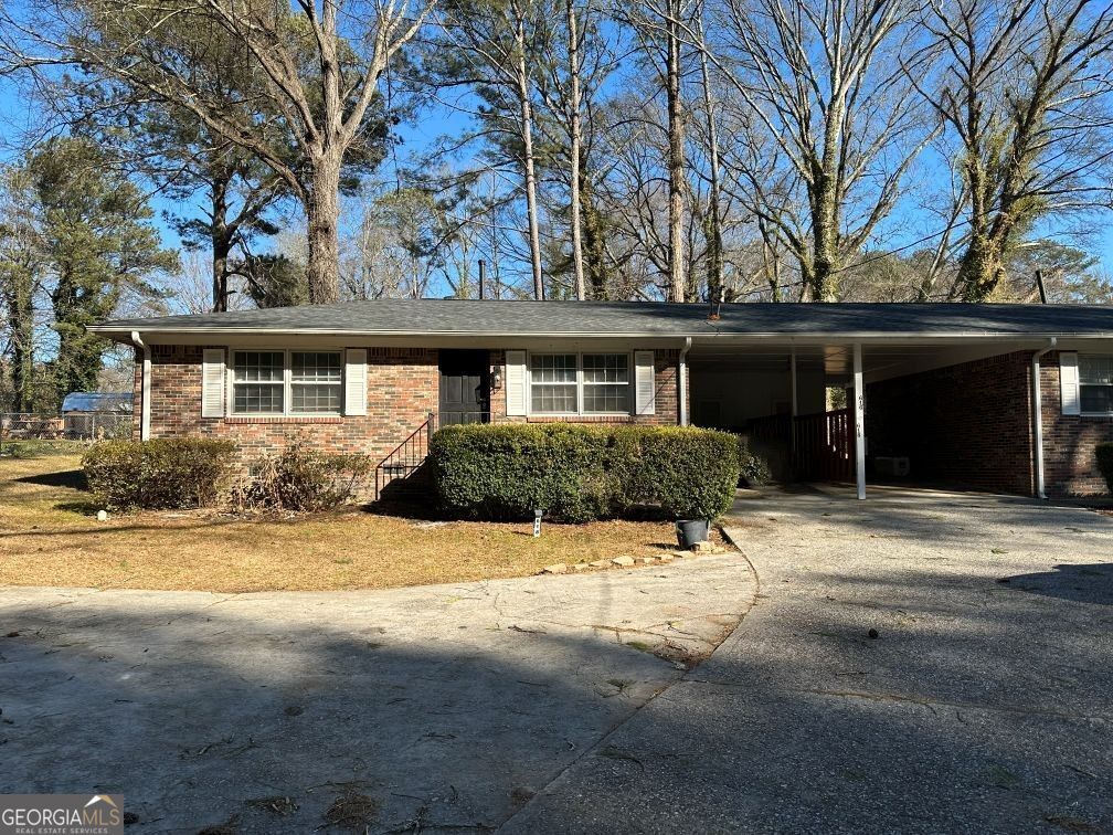 616 Fayetteville Road, Unit 616 & 618 Jonesboro, GA 30236 - Photo 2 of 14 front view of house with a yard