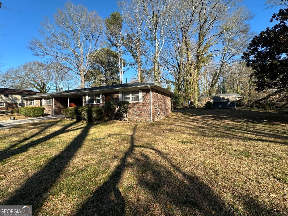 616 Fayetteville Road, Unit 616 & 618 Jonesboro, GA 30236 - Photo 3 of 14 a view of a swimming pool with a yard