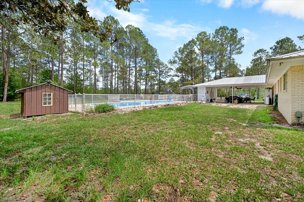 7422 County Road 231 Lake Butler, FL 32054 - Photo 38 of 57 a view of a house with a yard and sitting area