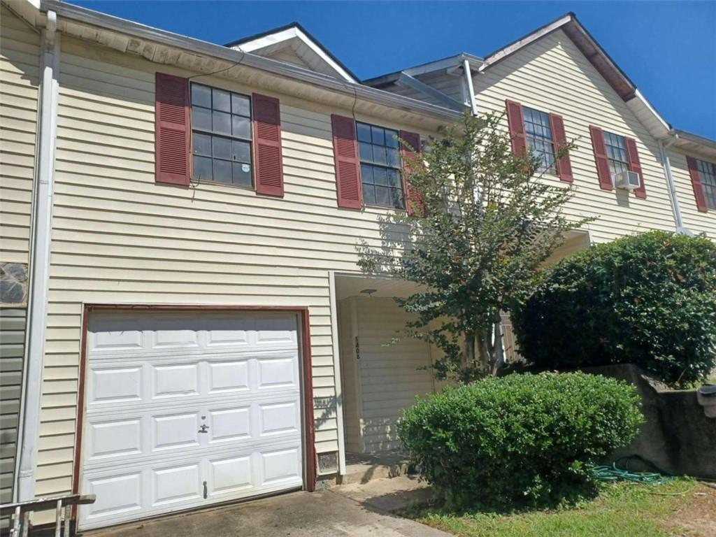 a front view of a house with a garage