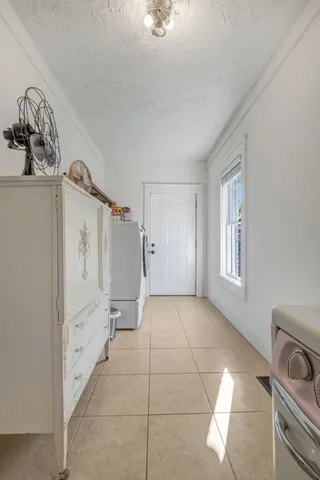 a view of a storage & utility room with closet window